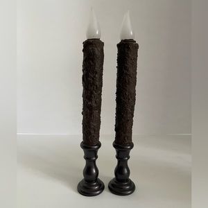 One pair of primitive candlesticks battery operated